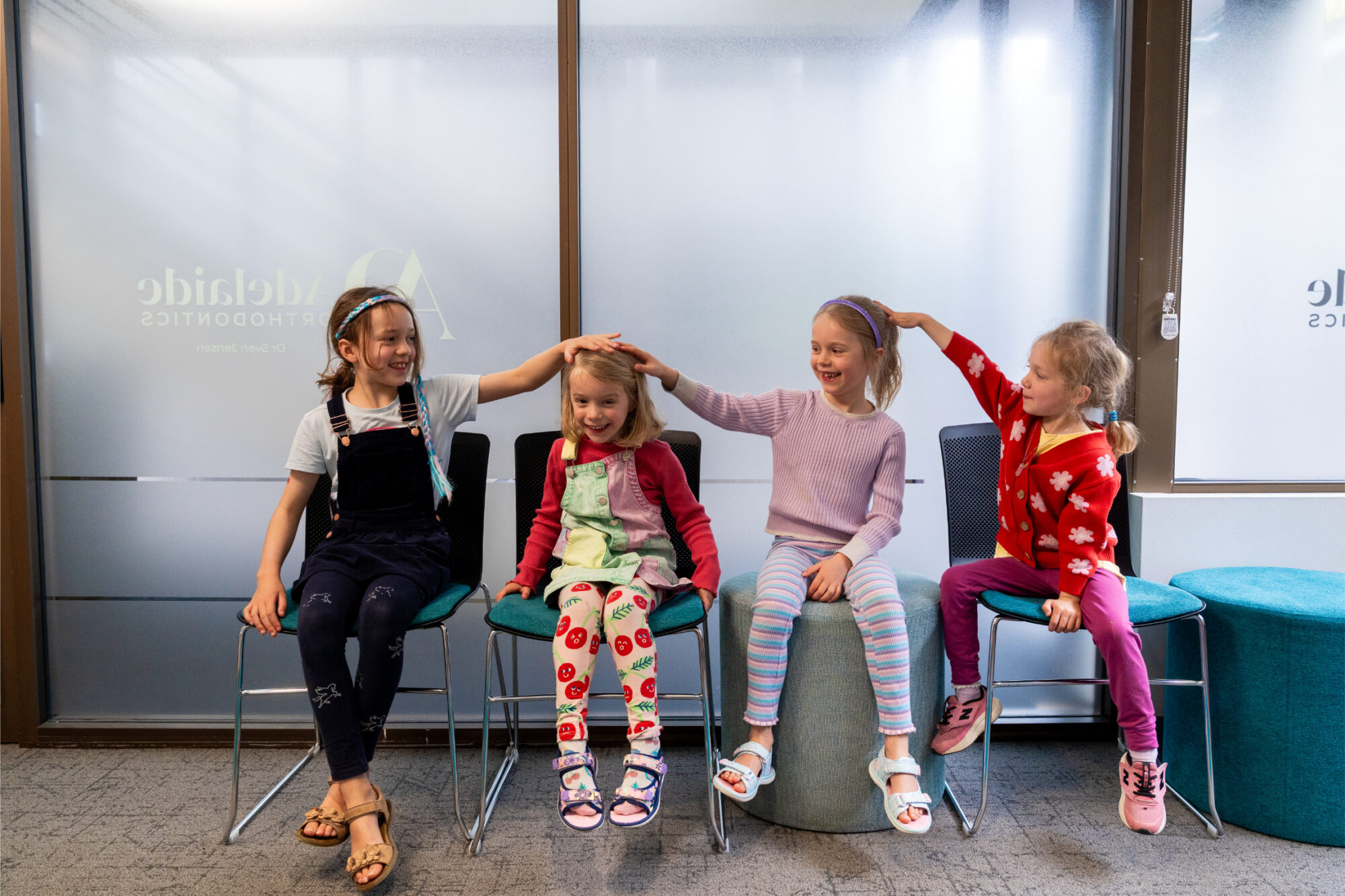 young girls laughing in office