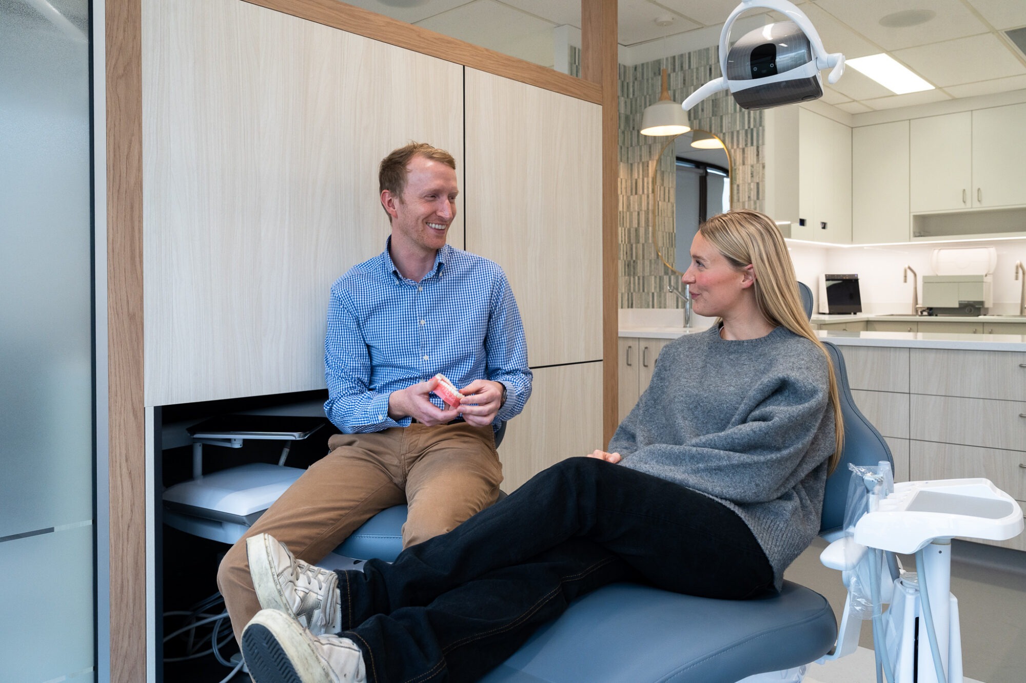 Dr Jensen consulting a patient on orthodontic treatment.