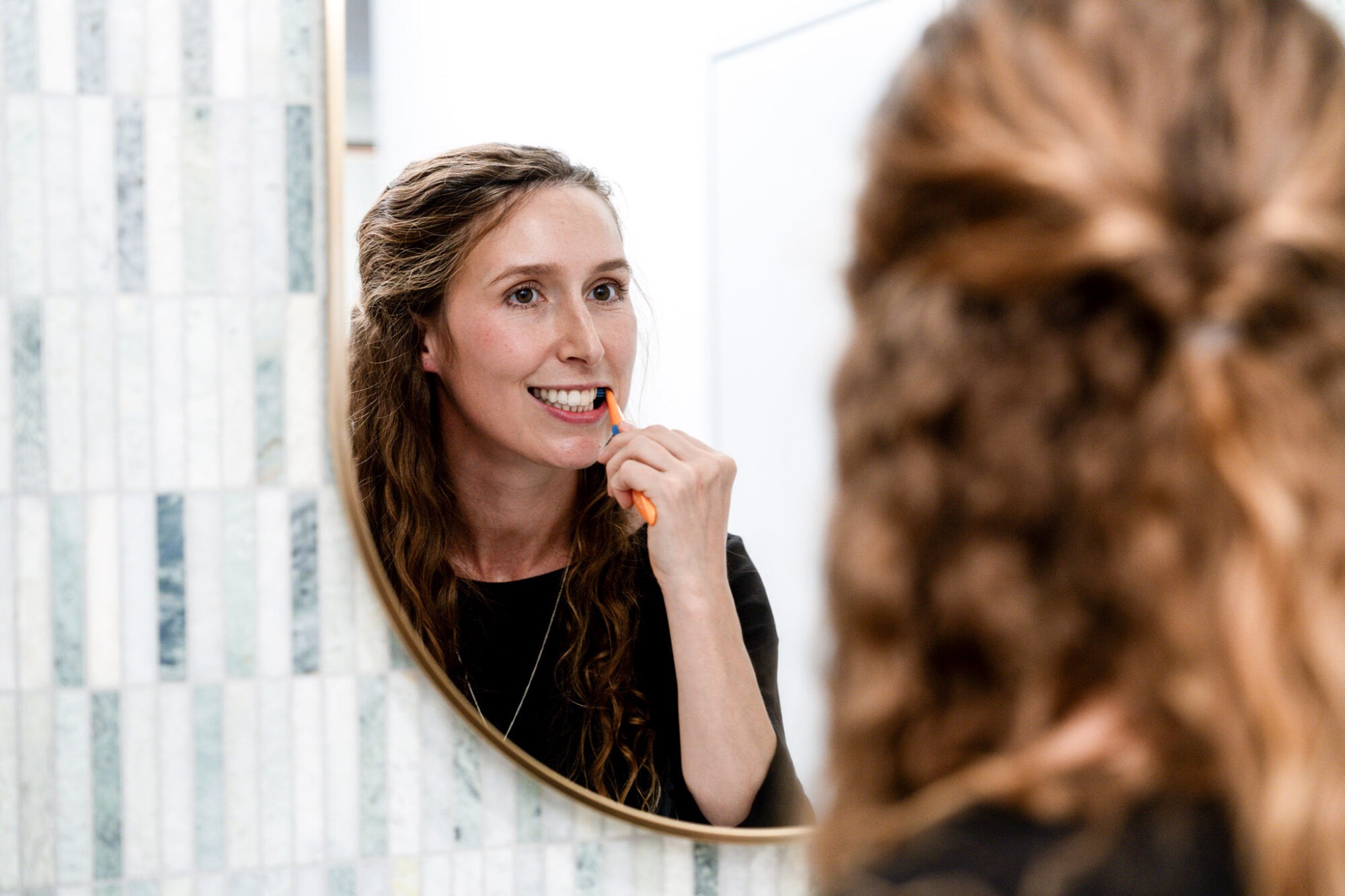Patient taking care of her teeth at Dr Jensen's office.